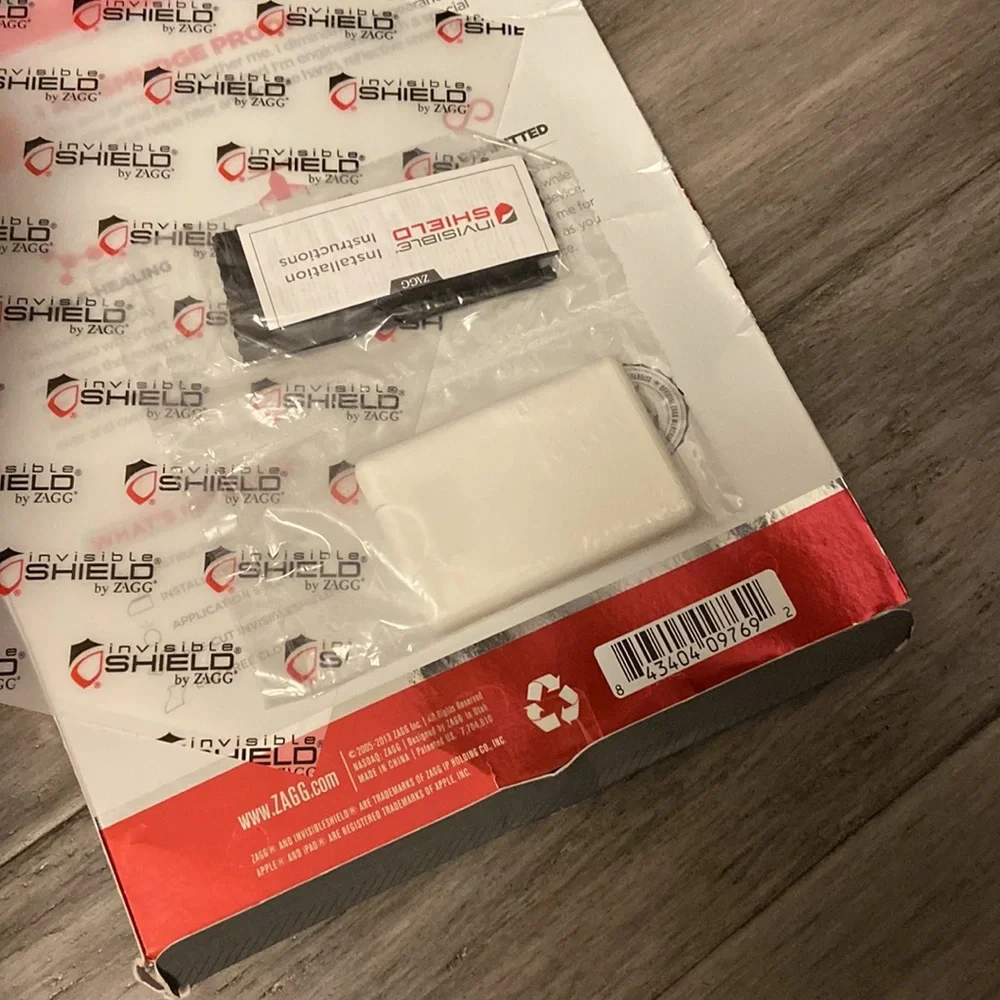 Zagg invisible shield smudge proof screen-cut to size for multiple phone uses